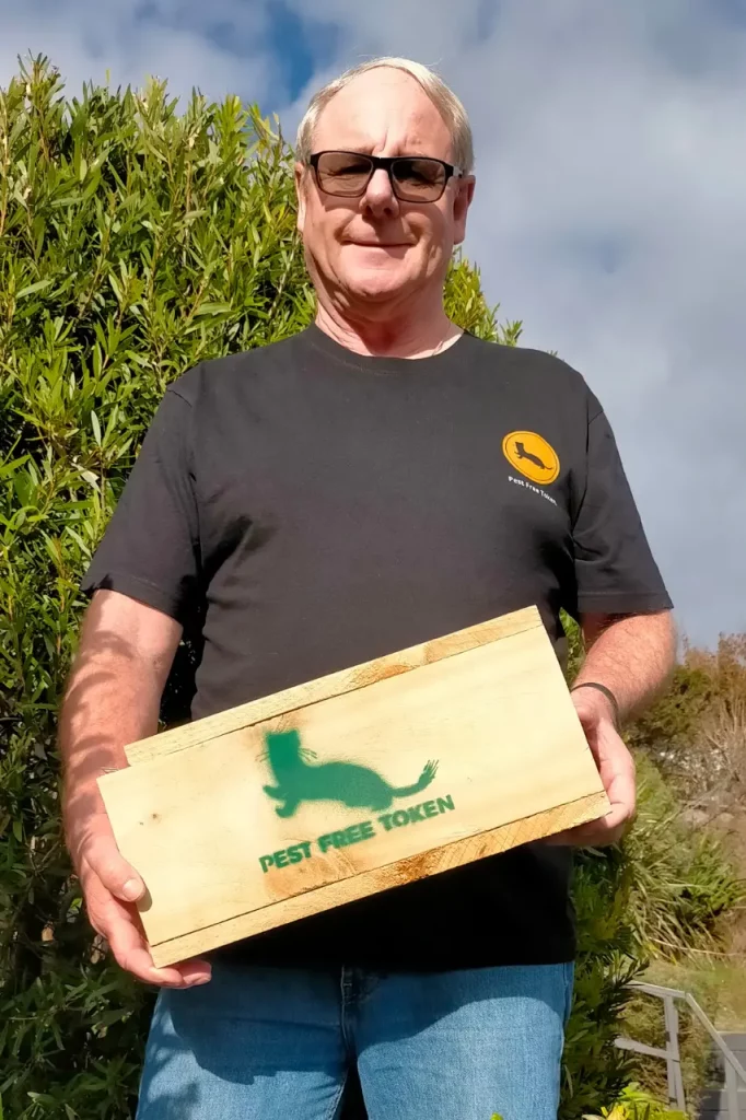 Meet the Pest Free Token Project Team -Alex holding a PFT Trap.