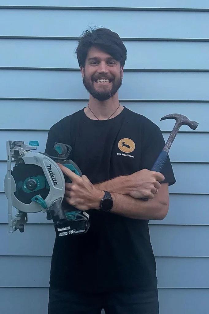 Meet the Pest Free Token Project Team  - Harrison holding power tools ready to make more traps